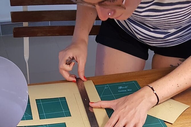 Discover Leather Workshops Experience in Old Town Hoi An - Shaping, stitching, and putting the item together