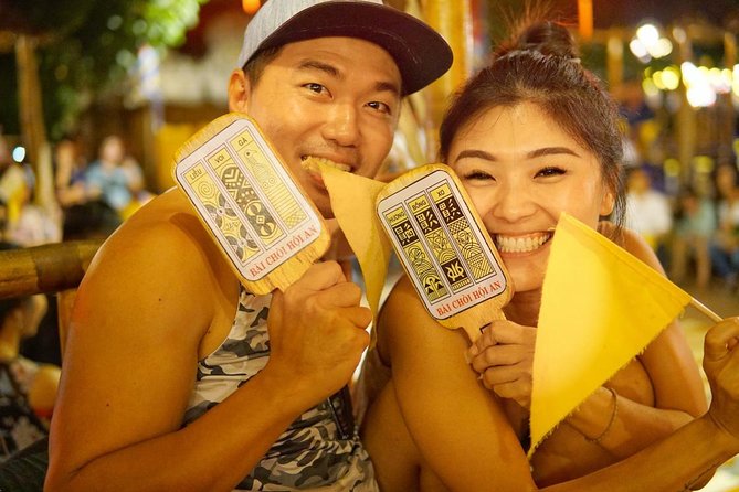 Evening Walking Food Tour, folk game and lantern boat - Vietnamese bingo and the Dap Nie game