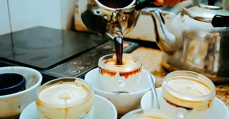 Exploring Vietnamese Coffee Culture, Coffee Making in Hoi An - Tasting the results with tea, music, and a cookie