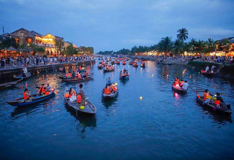 From Da Nang: Hoi An City Tour with Boat Ride and Lantern … - Walking through Hoi An’s Chinese assembly hall