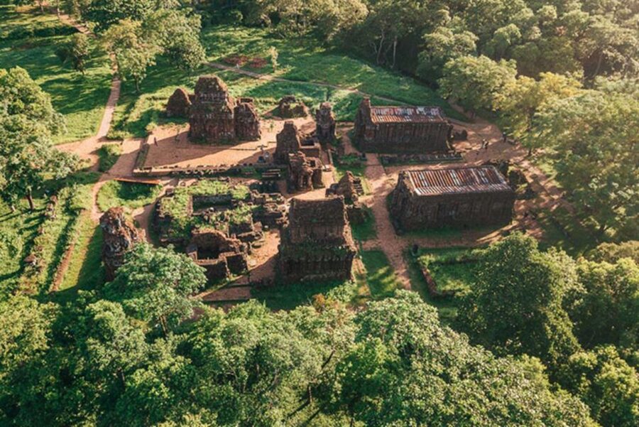 From Hoi An: Discover My Son Sanctuary & Sunset River Cruise - Walking through My Son’s Champa ruins