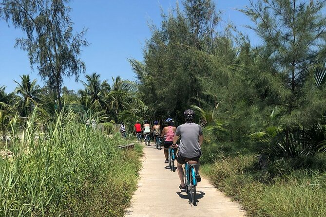 Half-day Hoi An Countryside Bike Tour and Basket Boat with Lunch - Crossing Cam Kim Bridge above the Thu Bon River