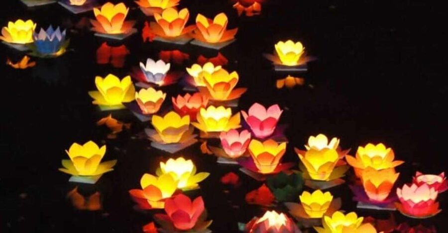 Hoi An: Night Boat Trip and Release Lantern at Hoai River - Hoi An’s waterfront after sunset