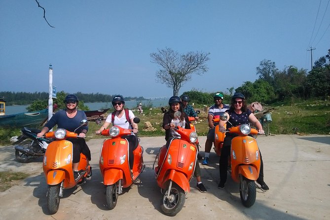 Hoi An Nightlife And Food Tour By Electric Scooter - Seafood by the riverfront