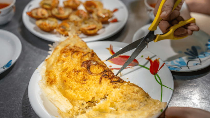 Hoi An: Private Evening Food Tour by Bike - Riverside barbecue with the historic quarter in view