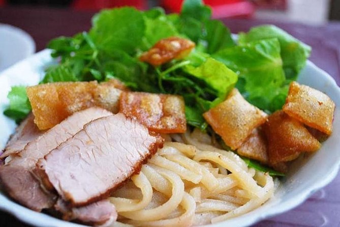 Hoi An Street Food Tour By Scooter - Stop one: Hoi An Night Market and the first tastes