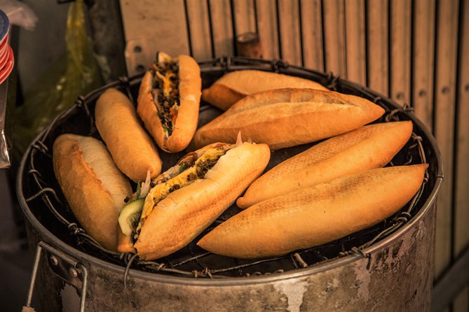 Private Hoi An Evening Food Tastings Tour by Bike - Nightfall by the river and the final grilled dishes
