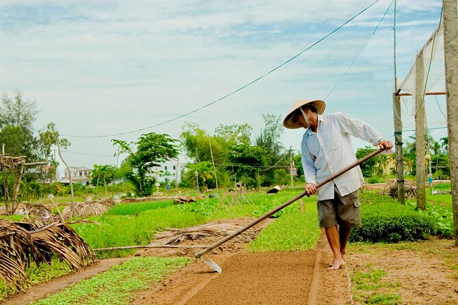 Tra Que Village Cycling And Farming - Cycling through rice fields and waterways